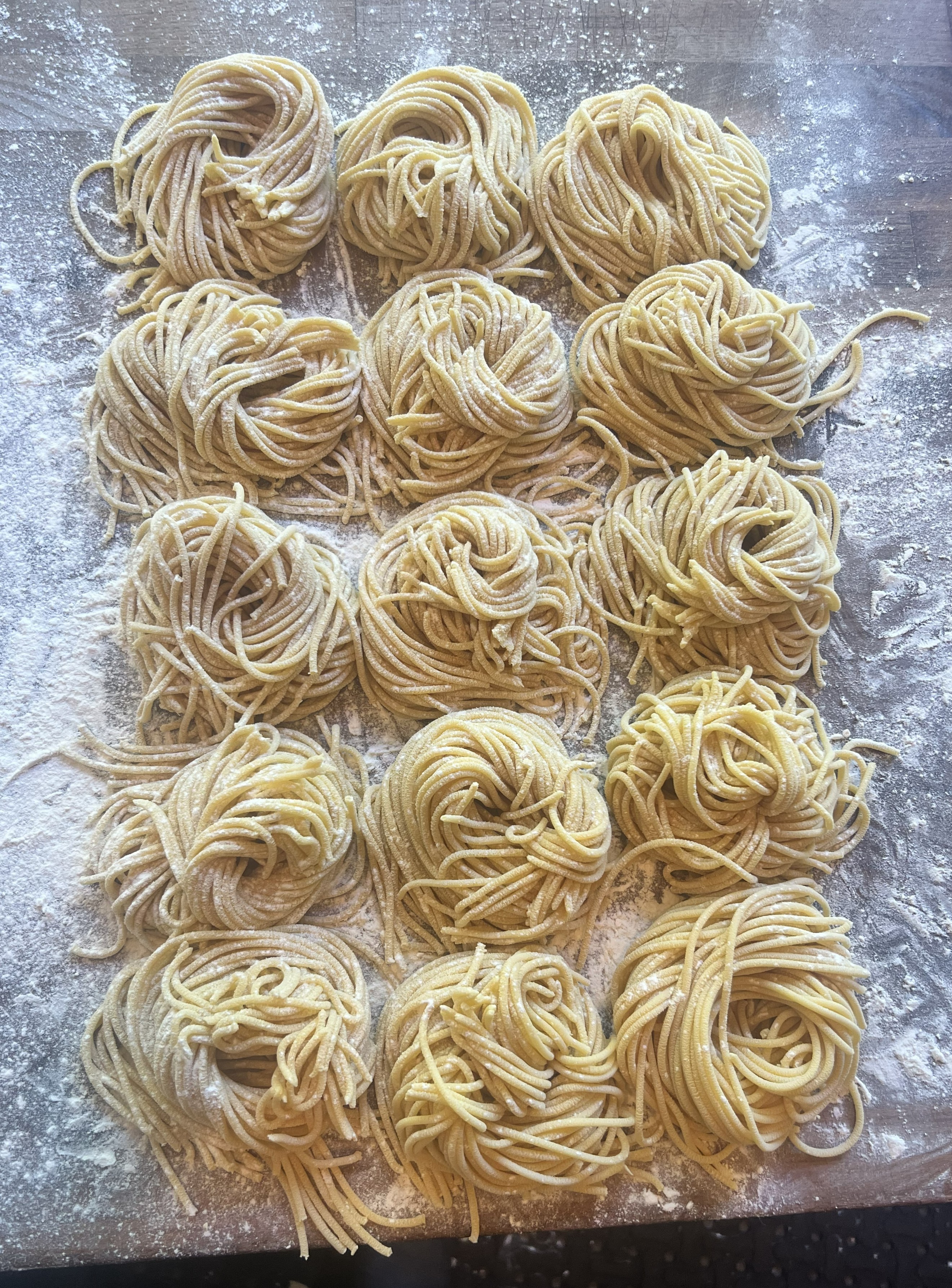 Fresh handmade spaghetti arranged in nests